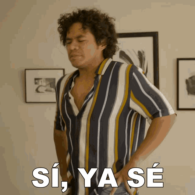 a man in a striped shirt is standing with his hands on his hips and says si ya se