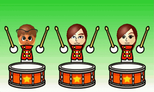 a man and two women are playing drums with sticks