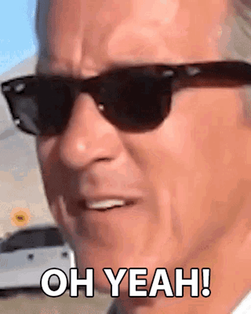 a man wearing sunglasses has the words oh yeah written on his face