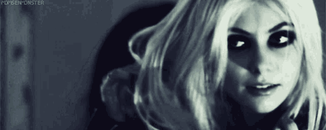 a woman 's face is shown in a black and white photo with the words monsenmonster written below her