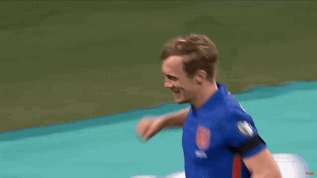 a soccer player in a blue shirt with the number 1 on it