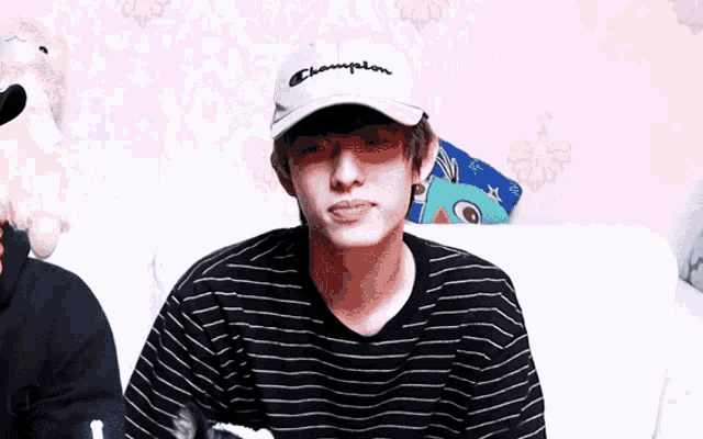 a person wearing a hat that says champion