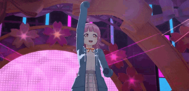 a girl with pink hair and a blue jacket is dancing on a stage