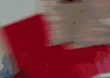 a close up of a person 's hand holding a white object .