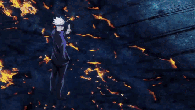 a person is flying through the air in front of a fire and smoke .