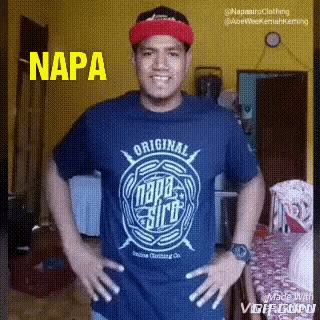 a man is wearing a napa shirt and a red hat