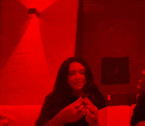 a woman wearing a black shirt that says " beast " on it
