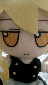 a close up of a stuffed animal with the letter a embroidered on it