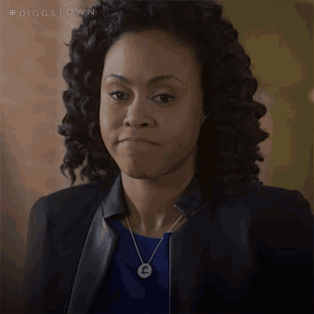 a woman with curly hair says i hate this in pink
