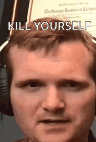 a man wearing headphones is looking at the camera with the words `` kill yourself '' on his face .