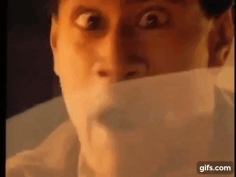 a close up of a man 's face with a bandage on his mouth .
