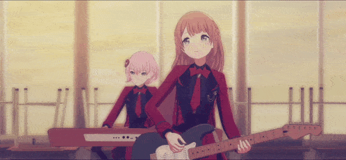 a girl playing a guitar next to a girl playing a piano