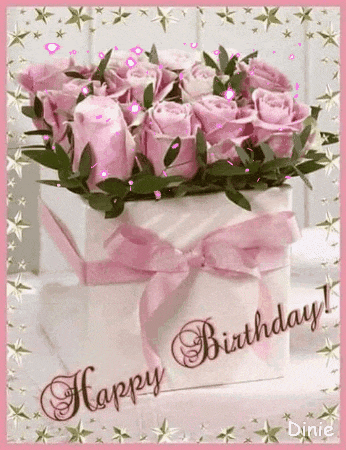a happy birthday card with a box of pink roses and a pink ribbon .