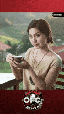 a woman is holding a cup of coffee in front of a sign that says heavy roses