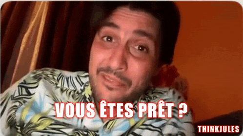 a man in a hawaiian shirt says vous etes pret ?