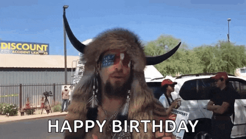a man in a buffalo costume says happy birthday in front of a discount store