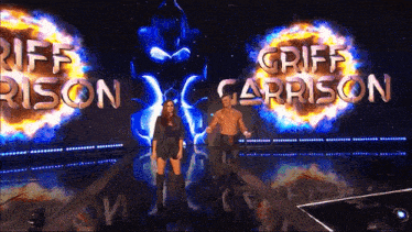griff carrison and riff rison are standing in front of a large screen