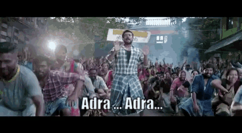 a man in a plaid shirt is dancing in front of a crowd with adra written on the bottom
