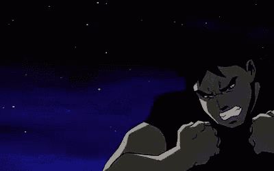 a man in a black shirt is standing in the dark with his arms outstretched and screaming .