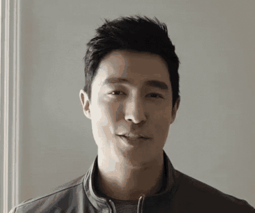 a close up of a man 's face with a white background
