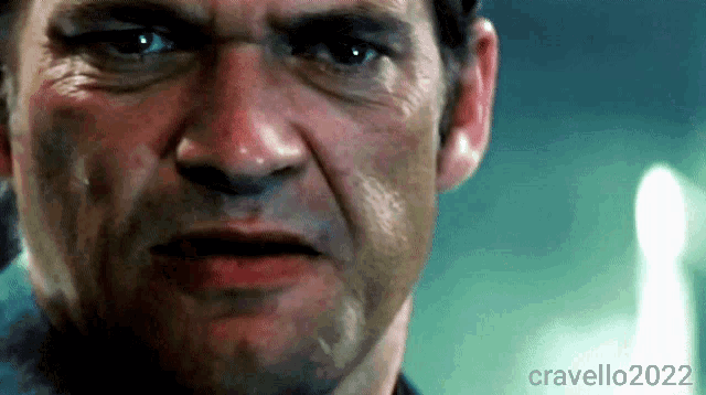 a close up of a man 's face with the year 2022 on the bottom right