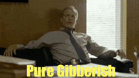 a man in a tie sits at a desk with the words pure gibberish on it
