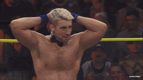 a man in a wrestling ring with the word impact on the bottom