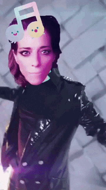 a woman in a black leather jacket has a music note on her head
