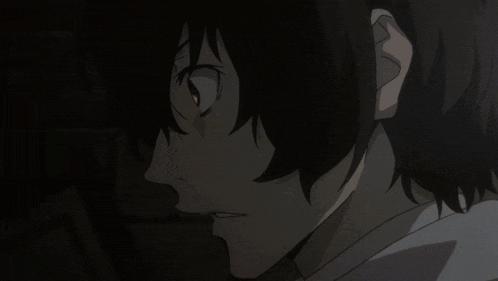a close up of a person 's face with a serious look on his face