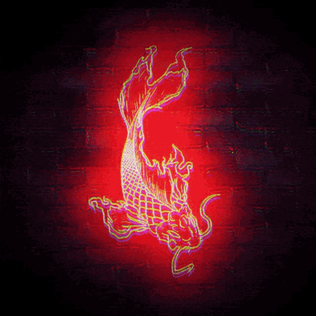 a neon sign of a fish is lit up on a red brick wall