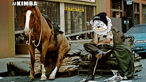 a man sitting on a pile of garbage next to a horse wearing a kimba beanie