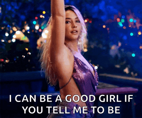 a woman in a purple dress is saying " i can be a good girl if you tell me to be "