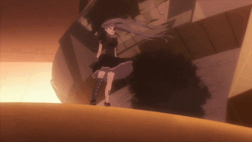 a girl in a black dress stands on a ledge
