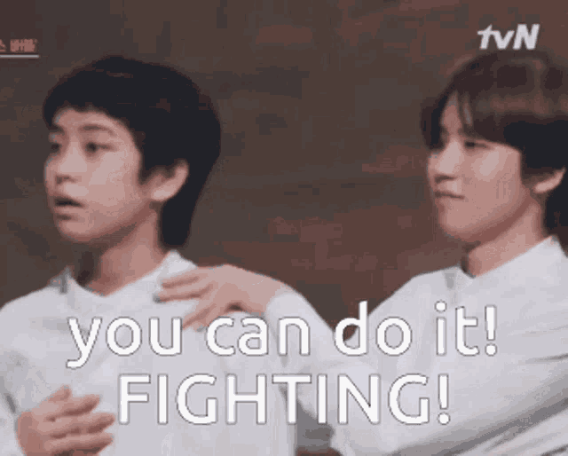 two young men are standing next to each other and one of them says `` you can do it ! ''