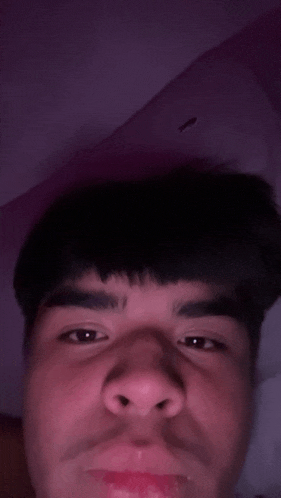 a close up of a man 's face with his mouth open