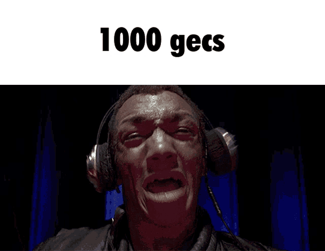 a man is making a funny face with the words 1000 gecs behind him