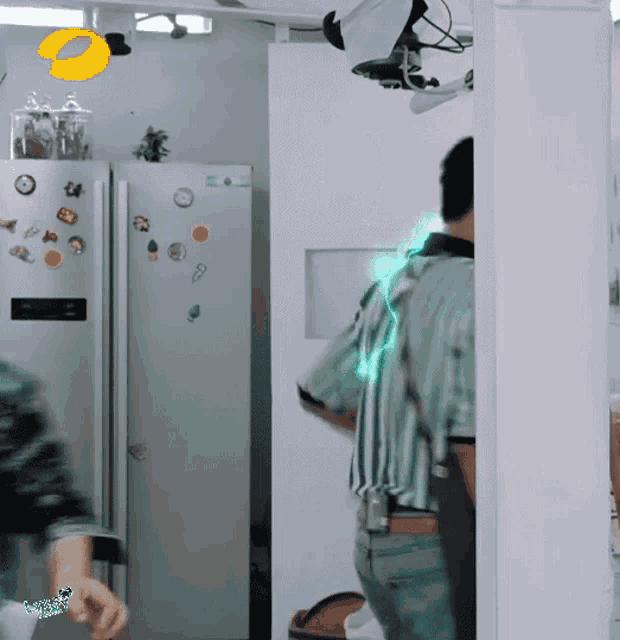 a man stands in front of a refrigerator with a sticker on it that says ' ice cream ' on it