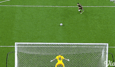 a soccer player runs towards the goal with the word uefa on the bottom
