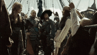 a group of pirates are standing on a boat and talking to each other