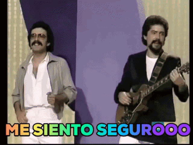 two men are standing next to each other and one is playing a guitar and the words " me siento segurooo " are above them