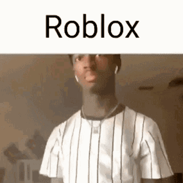 a man wearing a striped shirt and a necklace is standing in front of a white background with the word roblox .