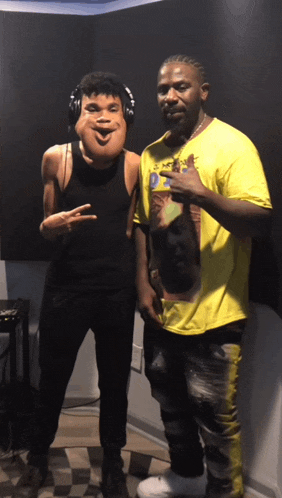 two men posing for a picture one wearing a mask