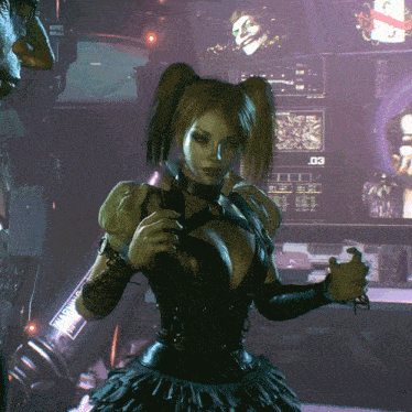 a woman in a black dress is standing in front of a monitor that says d3