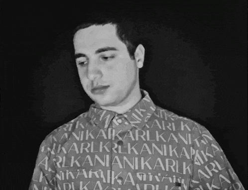 a man is wearing a shirt that says karlkani on it