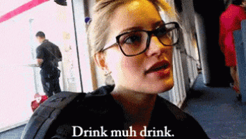 a woman wearing glasses says drink much drink