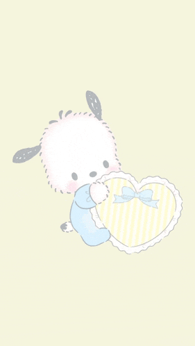 a baby pomeranian is holding a striped heart with a bow on it