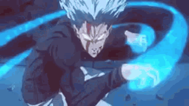 a man in a black hoodie is holding a blue object in his hands .