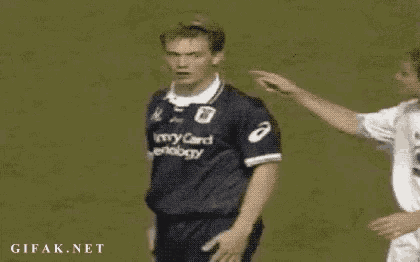 a soccer player wearing a jersey that says army card ecology is being touched by another player