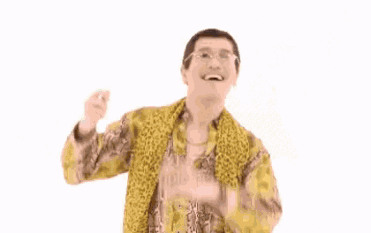 a man in a leopard print shirt and scarf is standing in front of a green screen that says ' uriel '