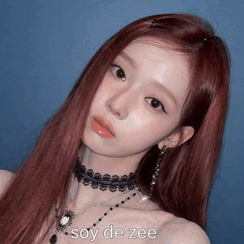a woman with red hair is wearing a choker and earrings